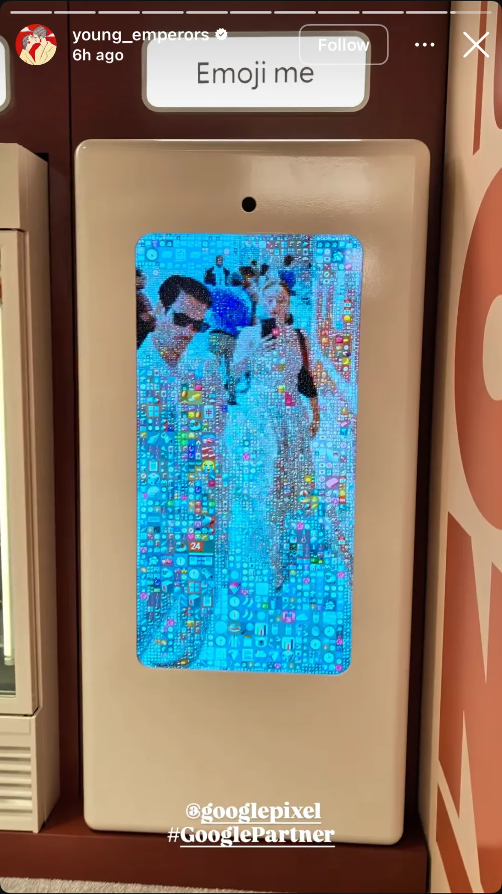 The mirror seen from across the room, two guests in blue standing in their own reflection